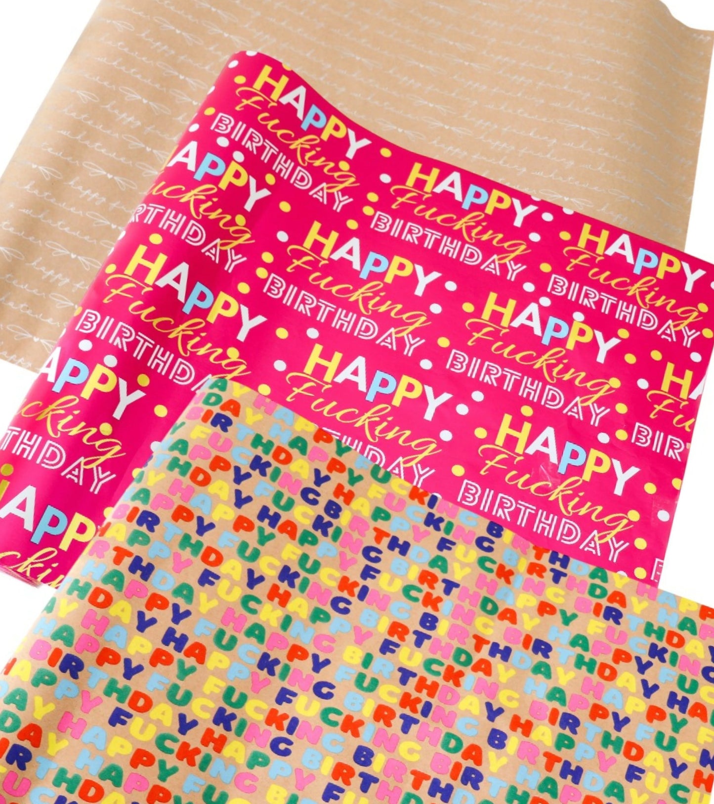 Three rolls of colorful birthday wrapping paper featuring bold, funny ‘Happy Fucking Birthday’ designs.
